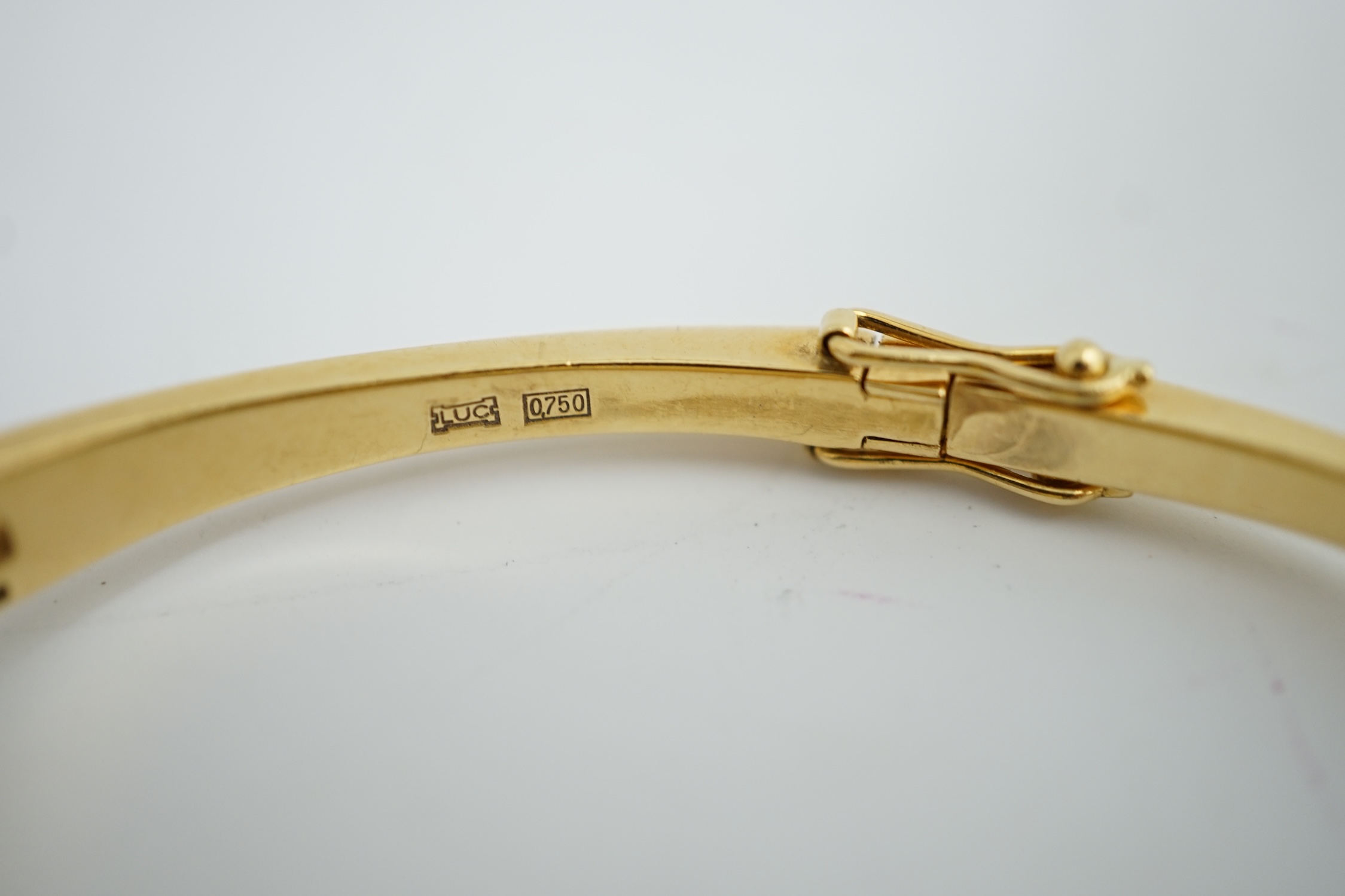 A lady's 18k gold Swiss Chopard manual wind hinged bangle wrist watch